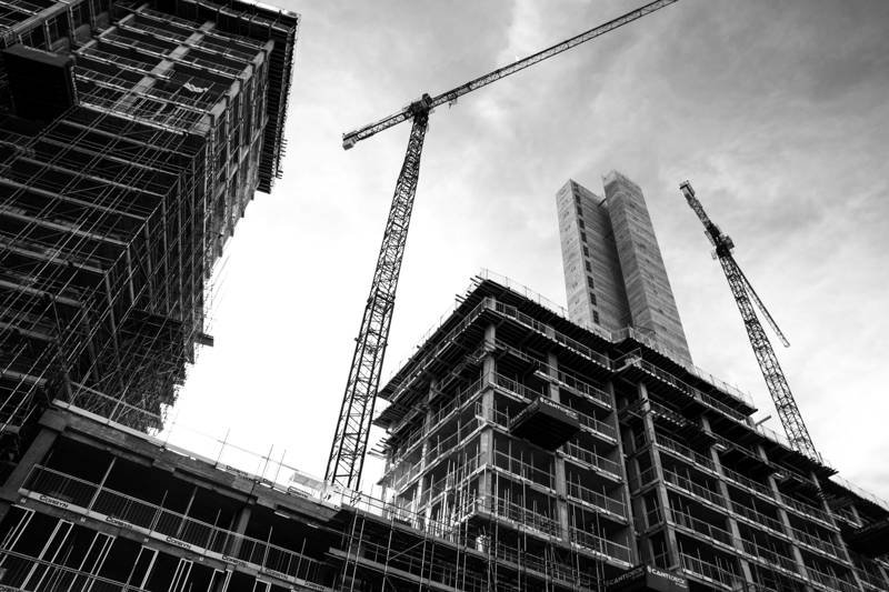 Construction site with cranes and scaffolding